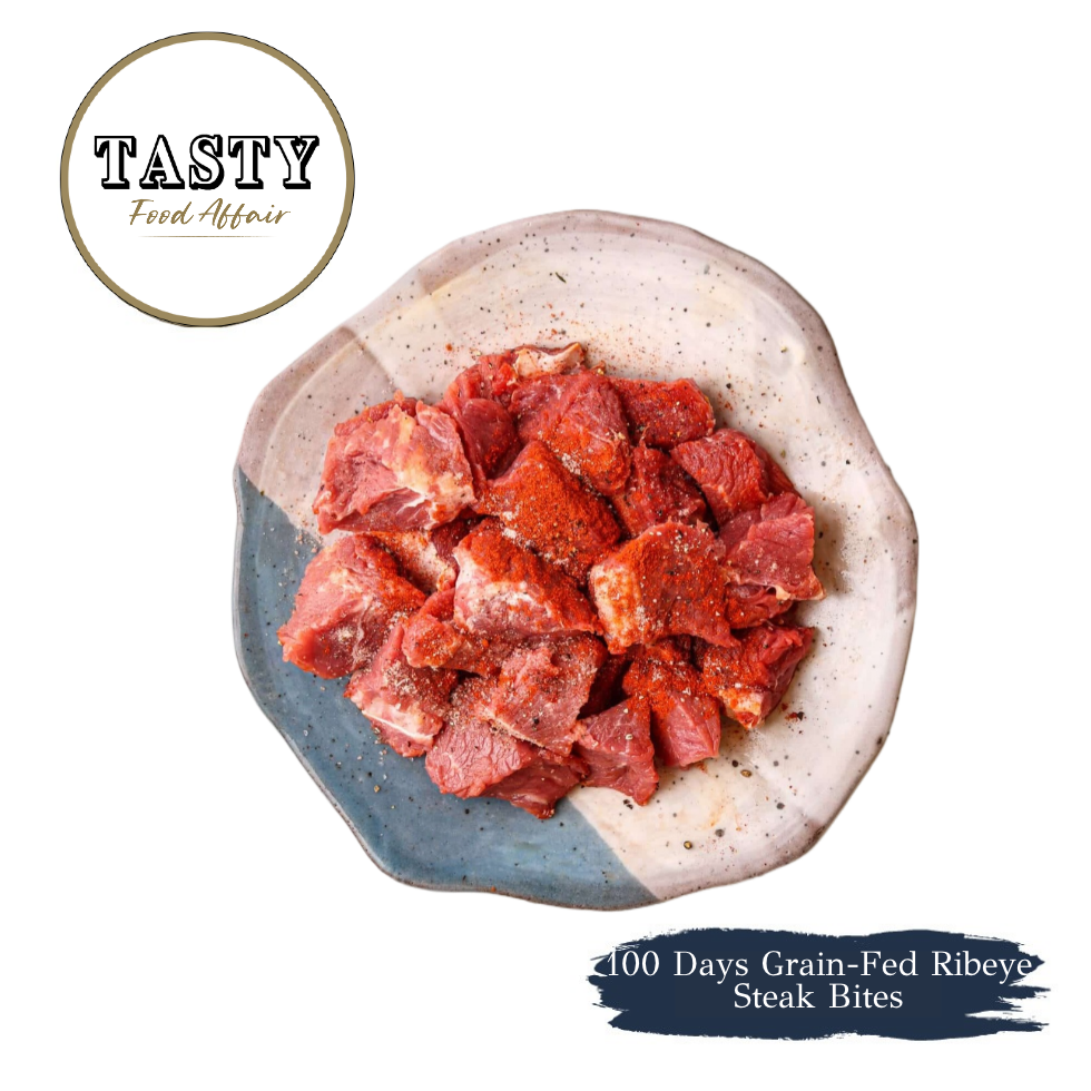 Seasoned raw ribeye steak bites cubed