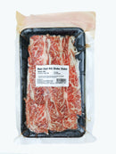 Packaged beef short rib shabu shabu in a clear plastic tray with a label on a white background.