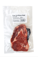 Grass Fed Ribeye Steak in a vacuum-sealed package with a label on a white background