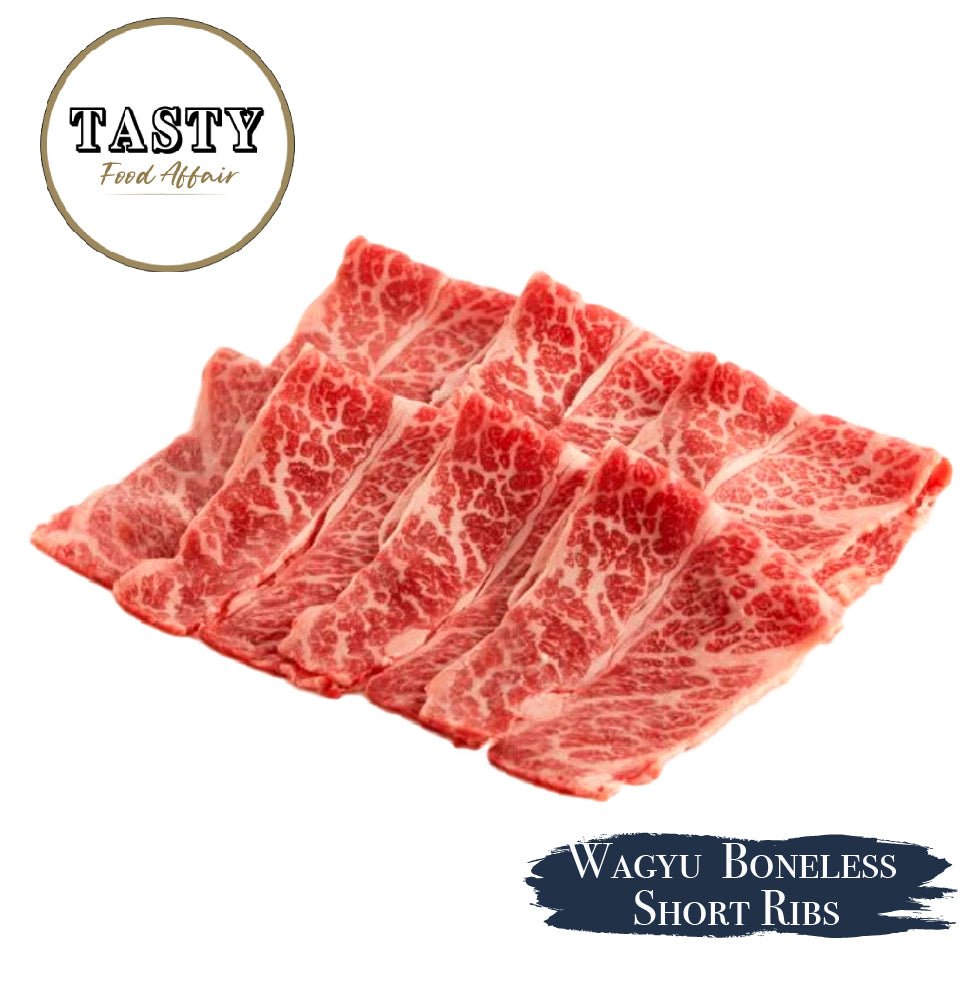 Raw Wagyu boneless short ribs with 'Tasty Food Affair' branding on a white background.