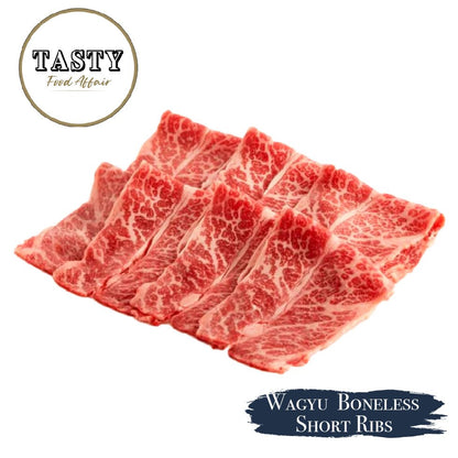 Raw Wagyu boneless short ribs with 'Tasty Food Affair' branding on a white background.
